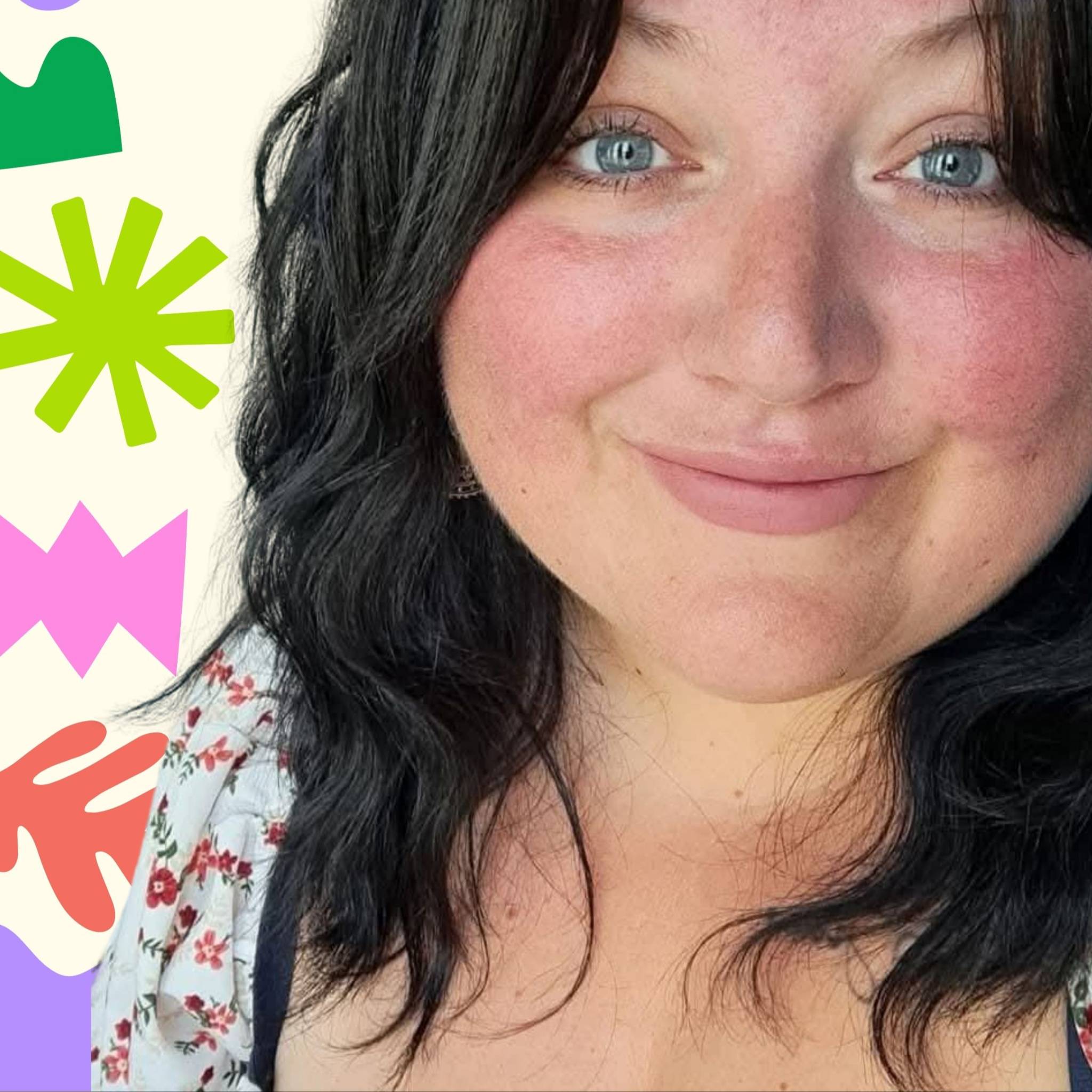 The founder of Wander Learn Create smiling, beside colourful cut-out shapes